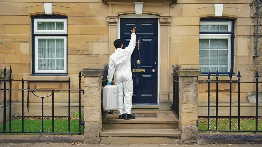Technician arriving at a Bradford terraced home